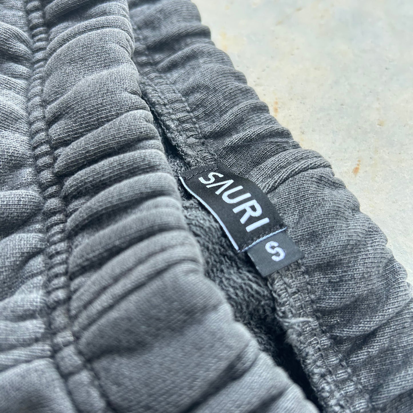 SOUNDCHECK WIDE LEG TRACK PANT IN BASALT